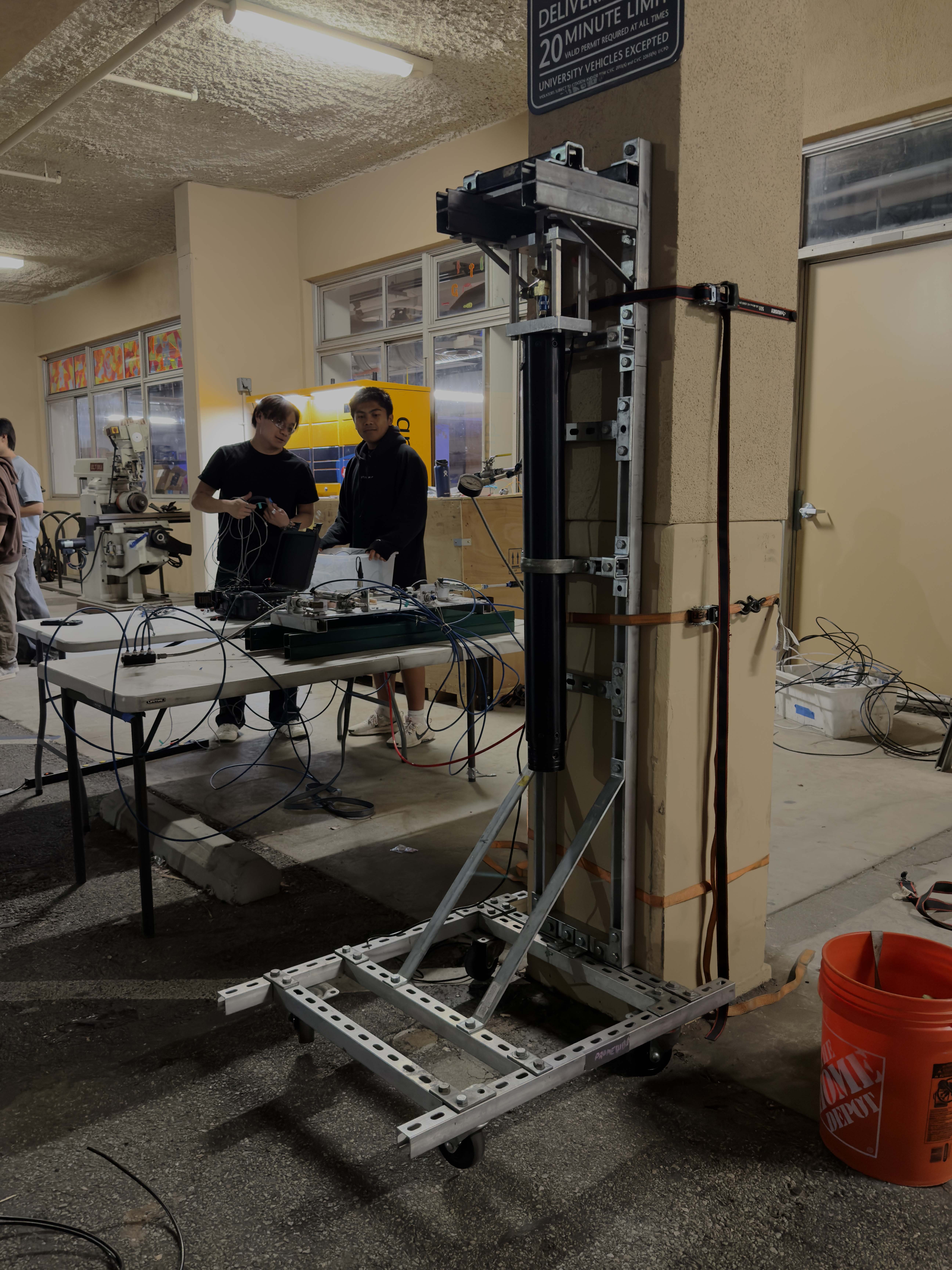 Vertical test stand from a prior COTS rocket motor firing, re-used as the tank mount base structure